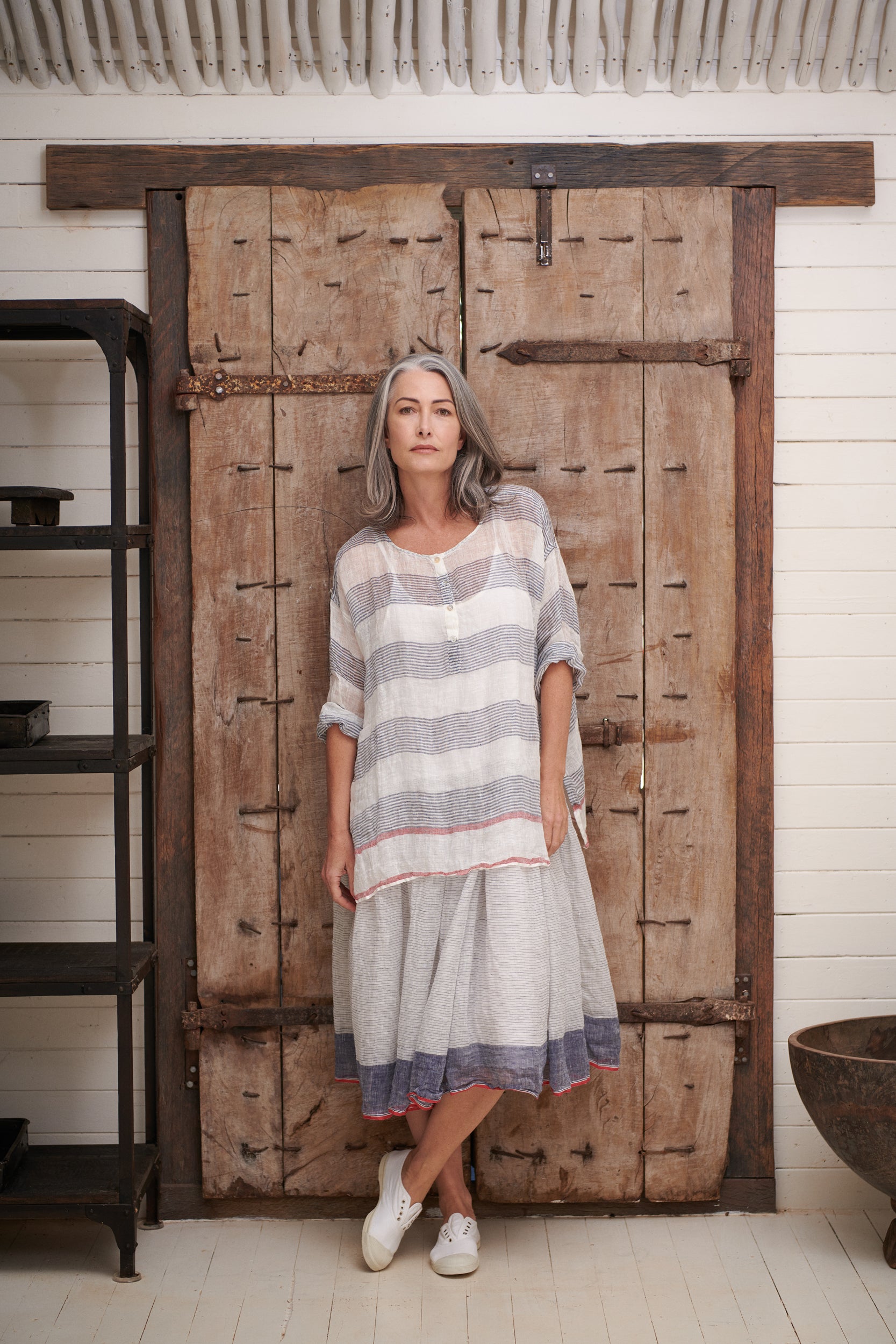 A MegbyDesign model is wearing an oversized style top made from gauze linen with a mother of pearl button neckline