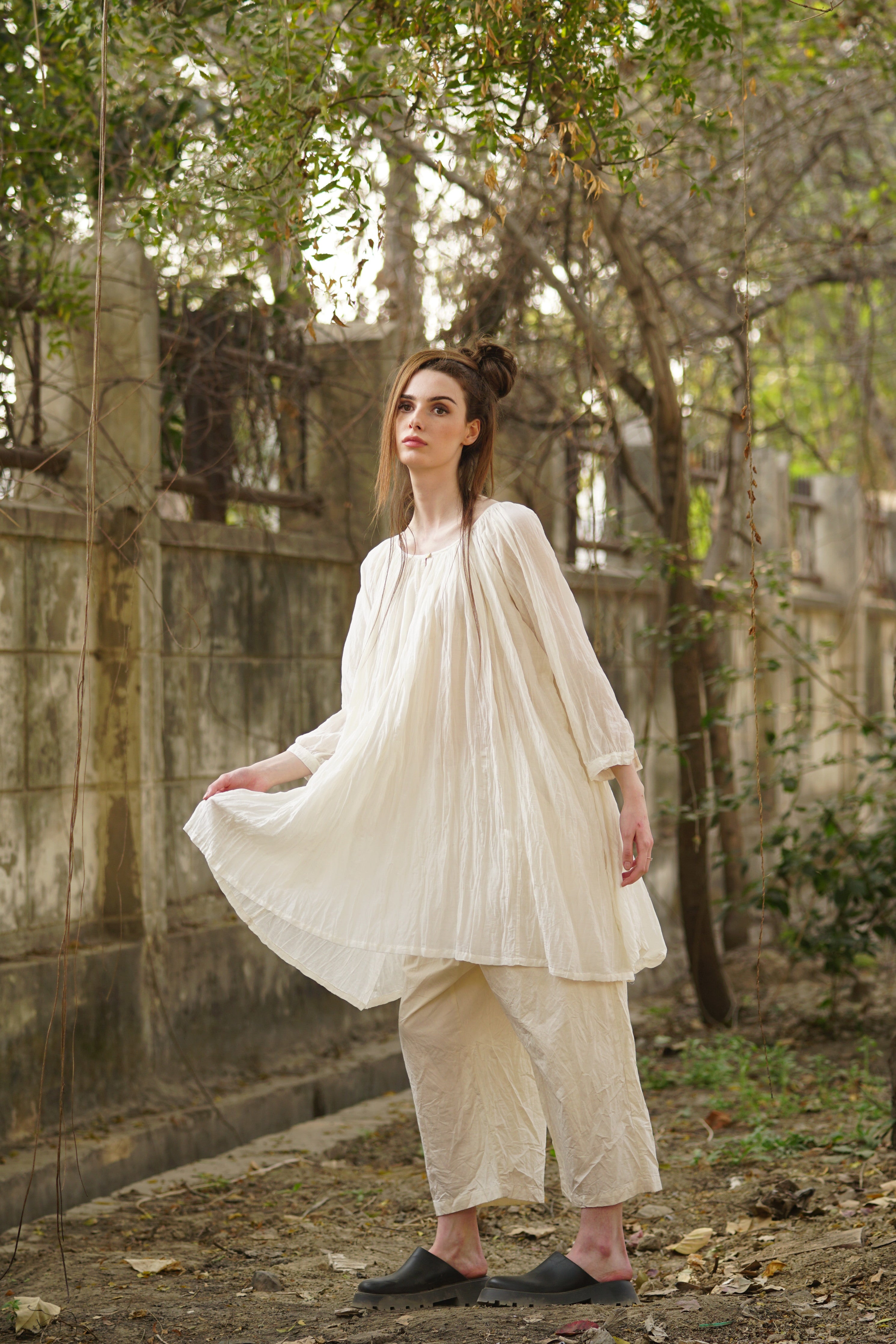 A MegbyDesign model is wearing a tunic style dress made from a soft blend of silk and cotton