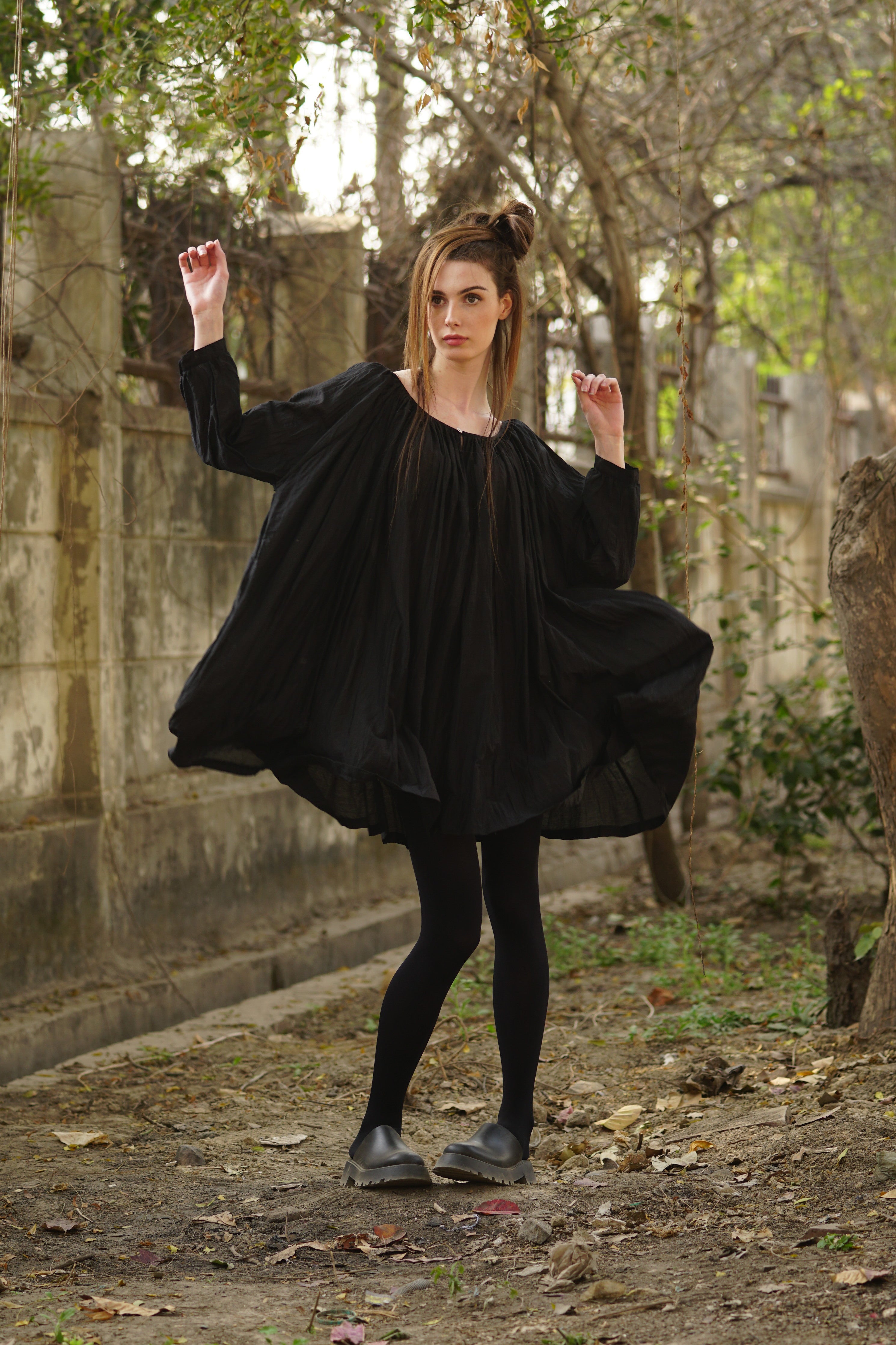 A MegbyDesign model is wearing a tunic style dress made from a soft blend of silk and cotton